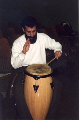 Photo of EVS Staff member playing a bongo drum