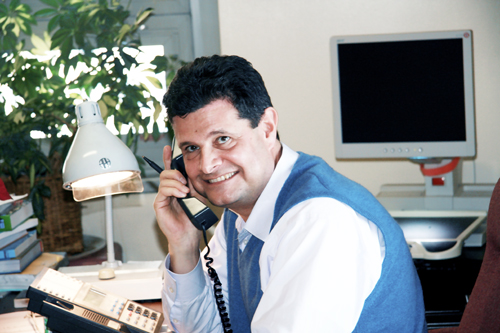 Doctor Laurence Gardner, director of Educational Vision Services, sitting at his desk
