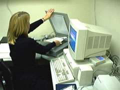 photo of vision specialist using state of the art computer equipment