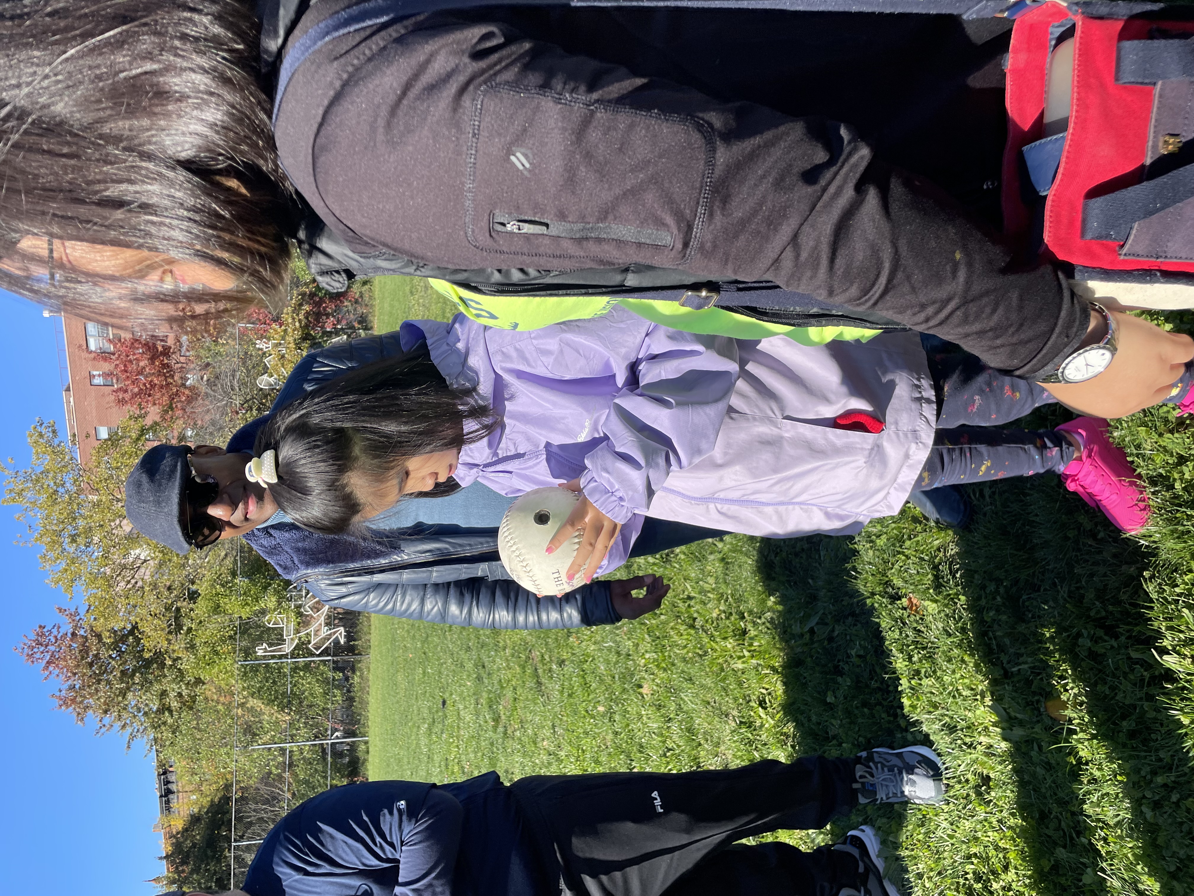 Photo of a student holding and exploring a ball..