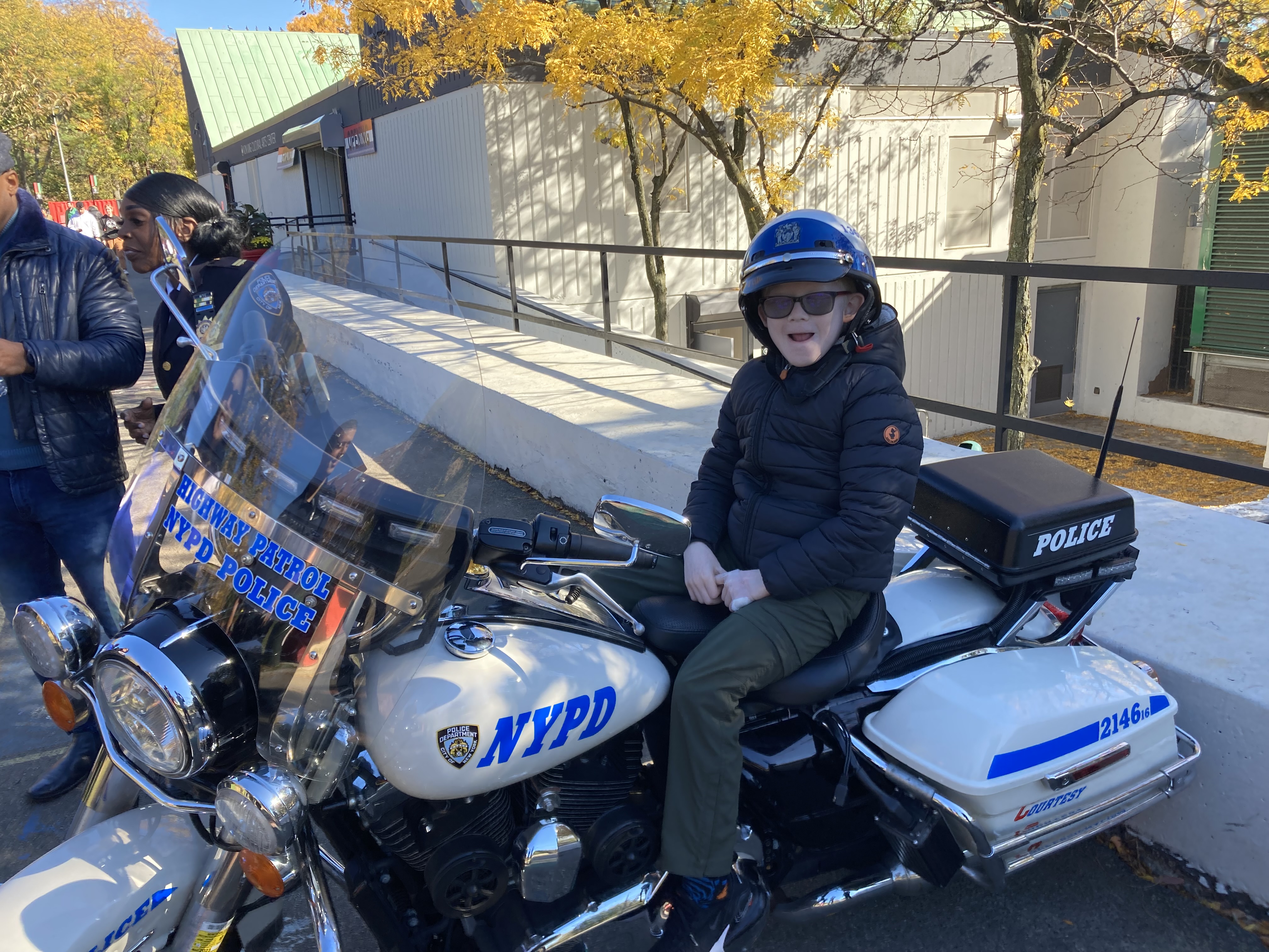 Photo of a student sitting on a motorcycle.